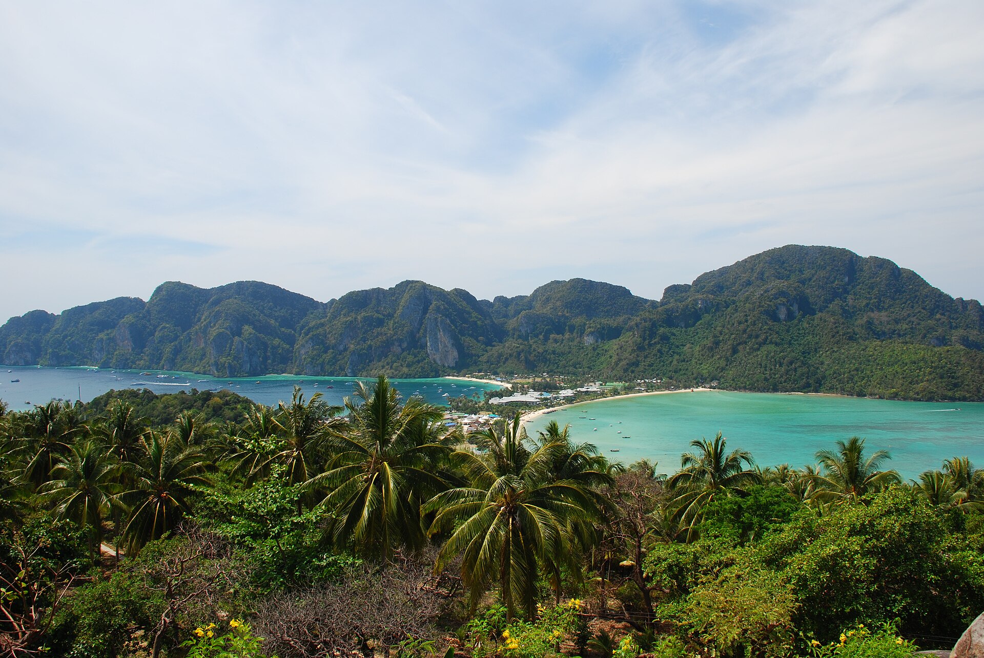 Elevated view over the twin turquoise bays and forested isthmus of Koh Phi Phi Don, Thailand